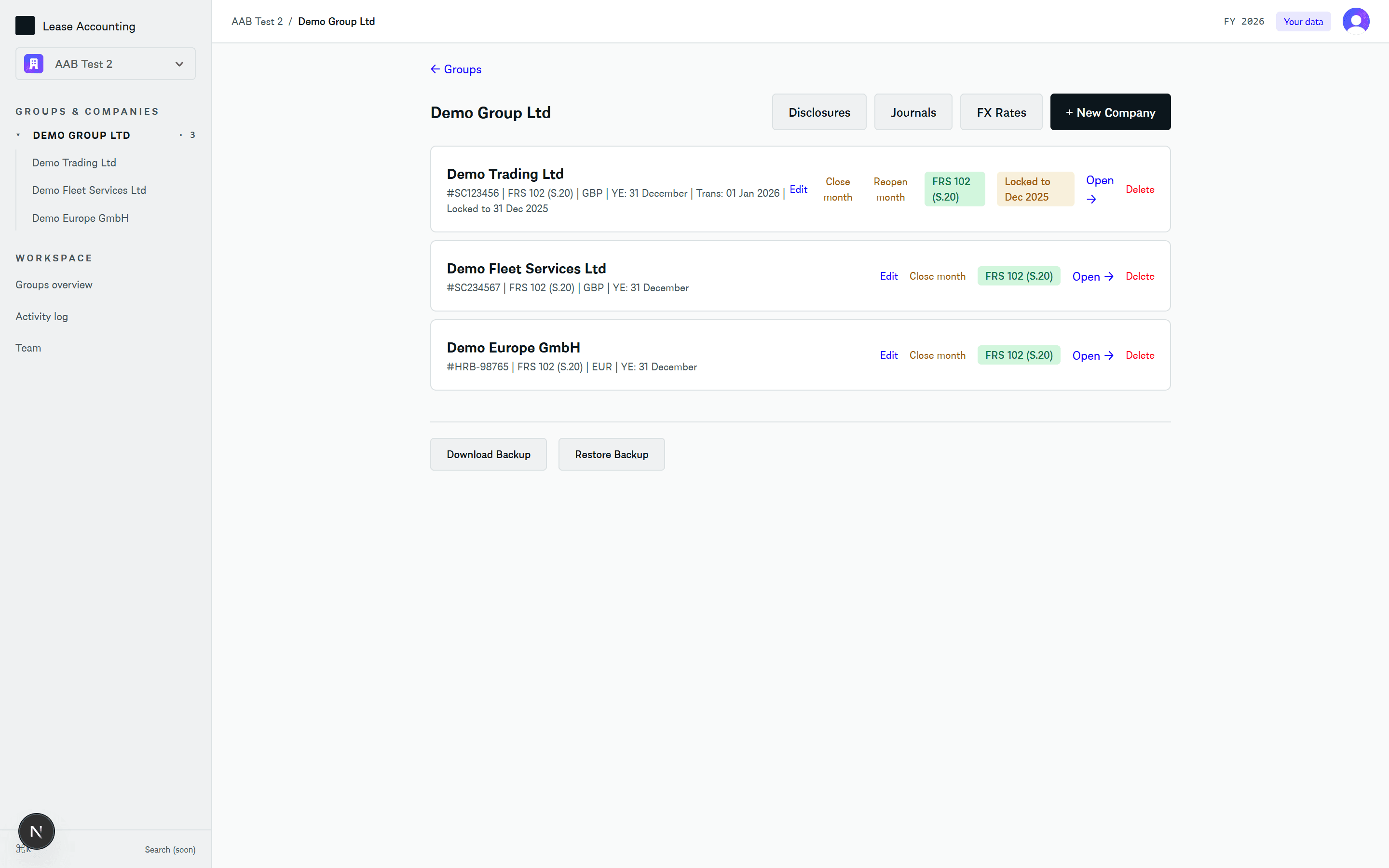 Group view: three companies with framework, currency, year-end and a locked period badge